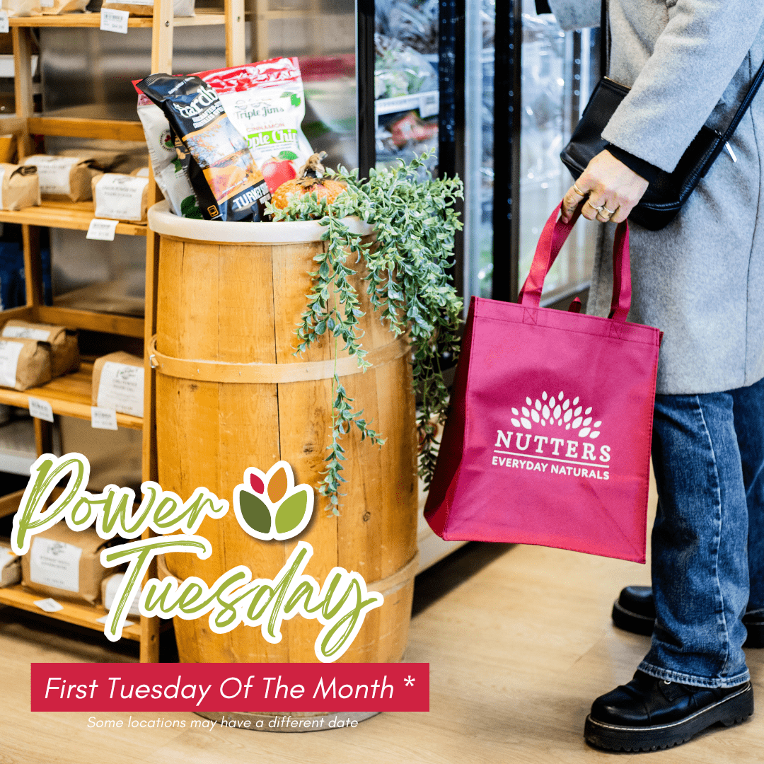 A photograph of a hot cup of tea with a lemon wedge along the rim of the cup. | Nutters